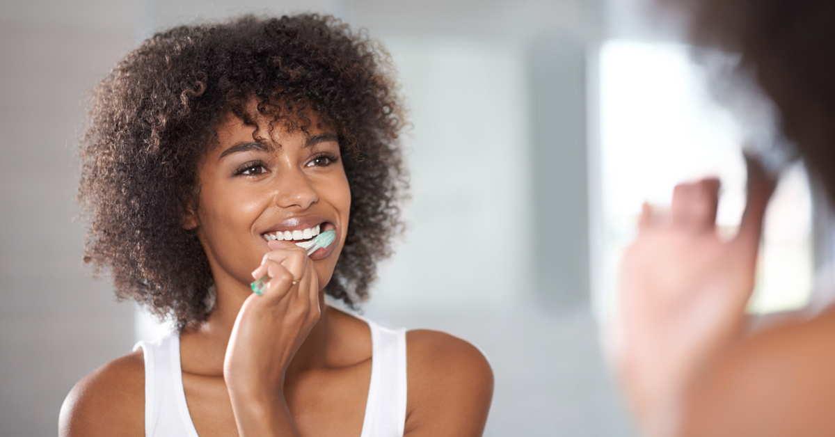 person brushing their teeth